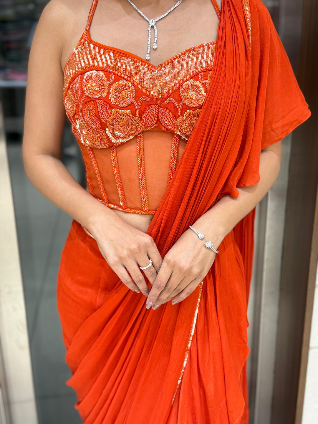 Radiant Orange Ready-to-Wear Saree with Embroidered Corset Blouse
