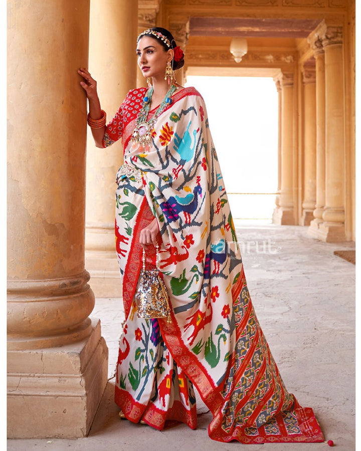 White Pure Patola Print Saree With Contrast Border and Unstitched Blouse