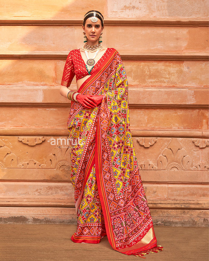Yellow Patola Printed Saree with Red Zari Border and Unstitched Blouse 01