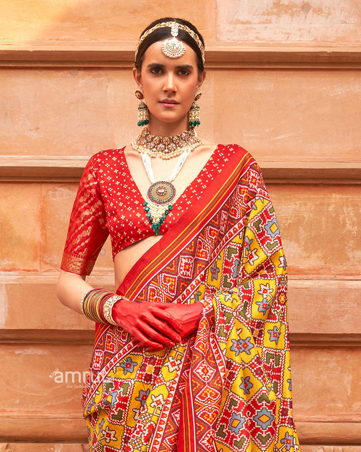 Yellow Patola Printed Saree with Red Zari Border and Unstitched Blouse 02