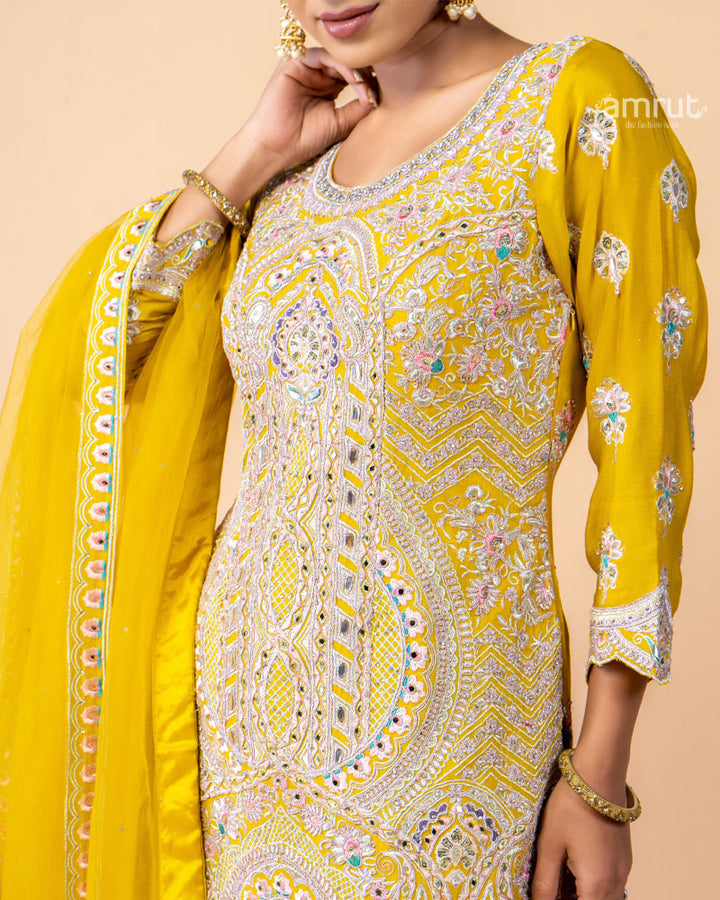 Yellow hand Embroidered Palazzo Set with a Net Dupatta