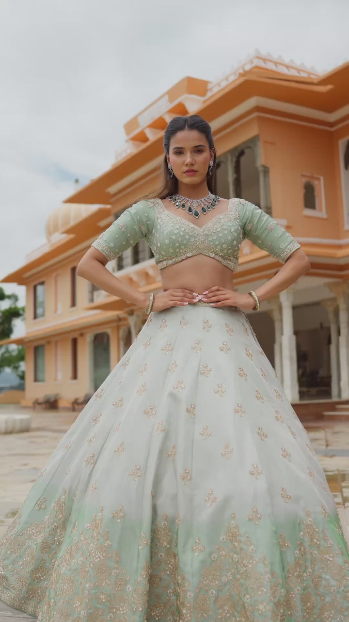Pastel Mint Green Lehenga Choli with Golden Floral Embroidery and Flared Skirt