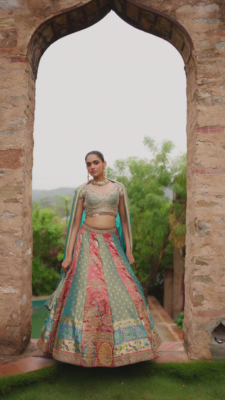 Teal Blue and Coral Pink Lehenga Choli with Multicolour Embroidery and Golden Borders