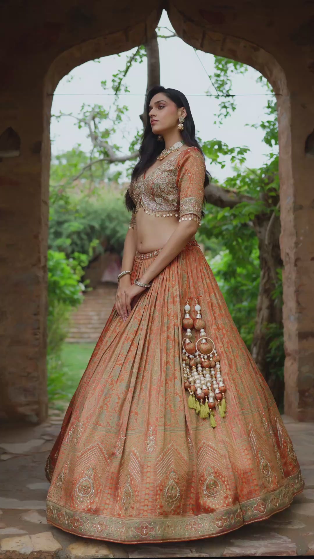 Peach and Rani Pink Lehenga Choli with Intricate Golden Embroidery