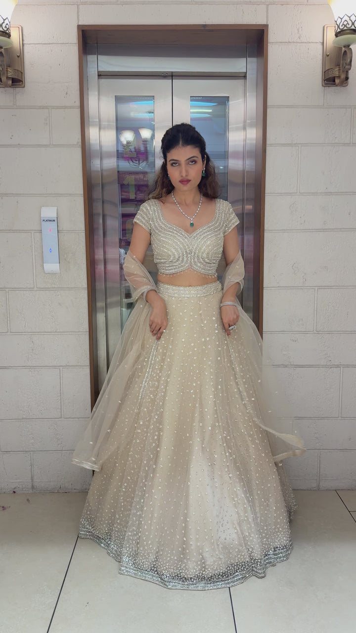 Champagne Sequin Embellished Lehenga with Wave Pattern Blouse & Sheer Dupatta