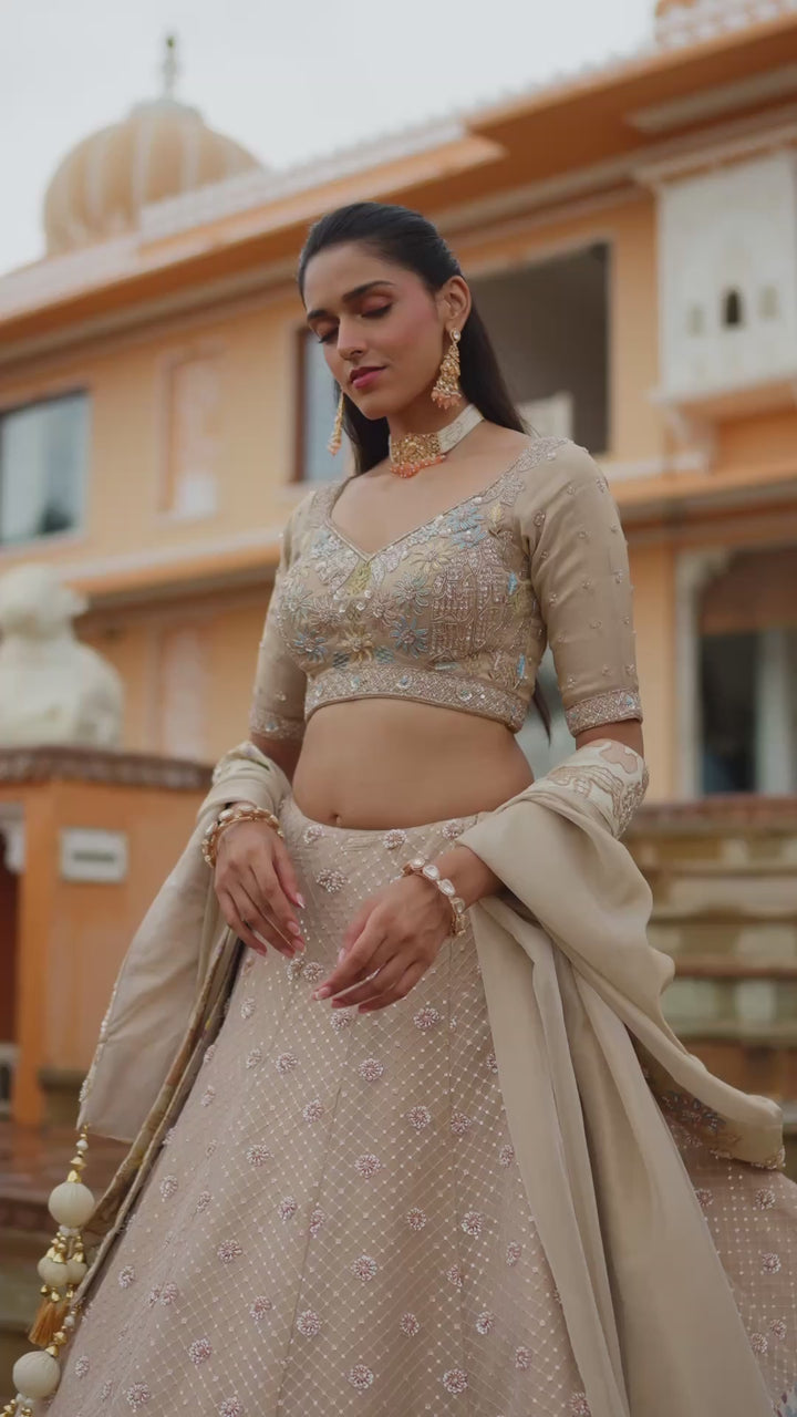 Champagne Beige Designer Lehenga Choli with Multicolour Floral Embellished Border