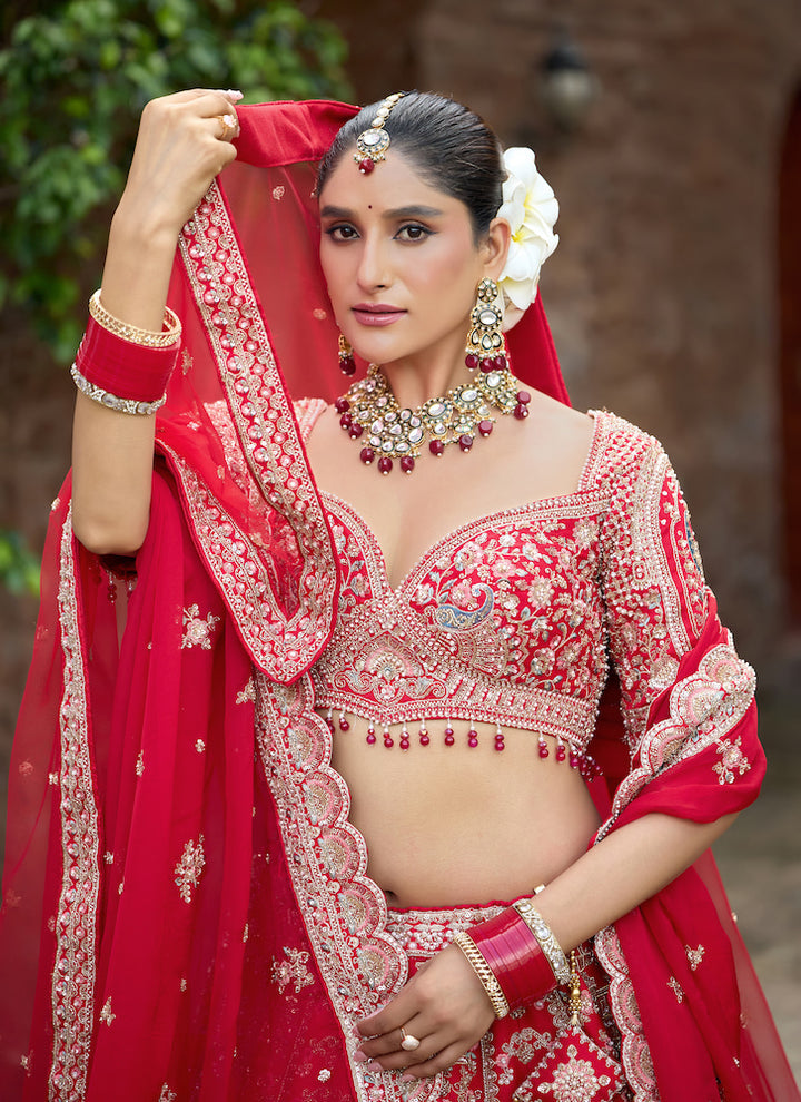 Crimson Royale – Red Bridal Lehenga with Intricate Silver Zari Embroidery