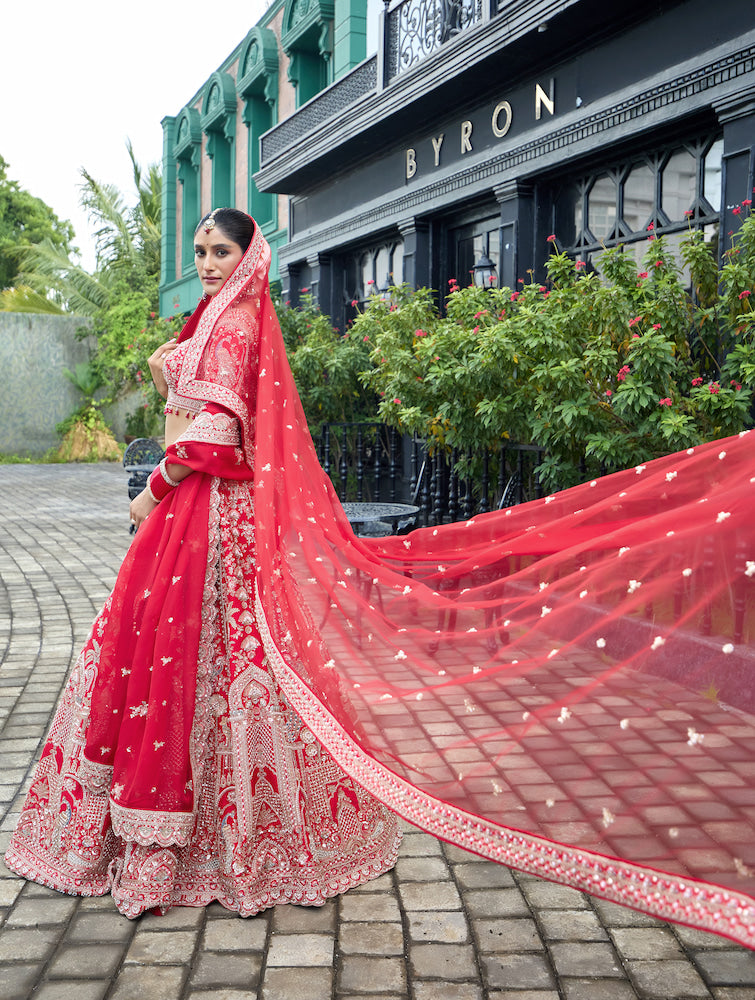 Crimson Royale – Red Bridal Lehenga with Intricate Silver Zari Embroidery