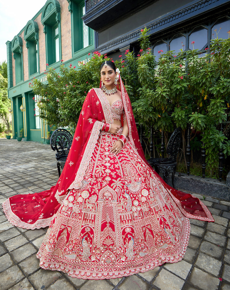 Crimson Royale – Red Bridal Lehenga with Intricate Silver Zari Embroidery