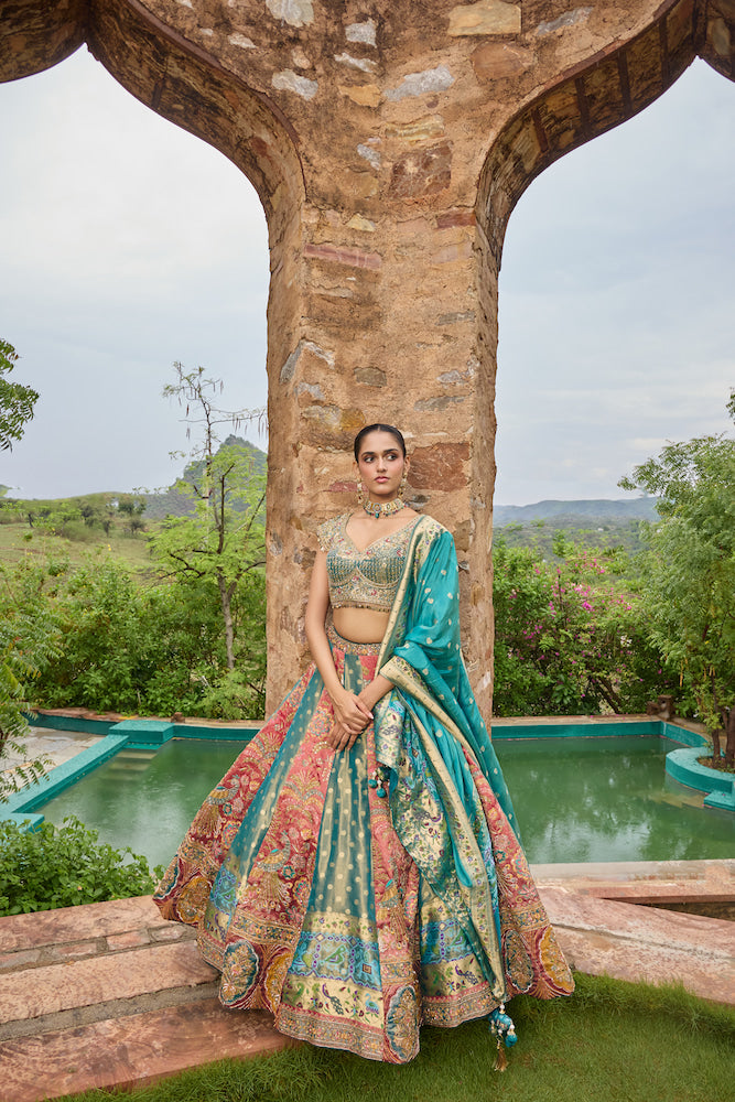Teal Blue and Coral Pink Lehenga Choli with Multicolour Embroidery and Golden Borders