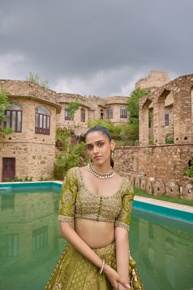 Olive Green Designer Lehenga Choli with Intricate Golden Embroidery and Traditional Motifs