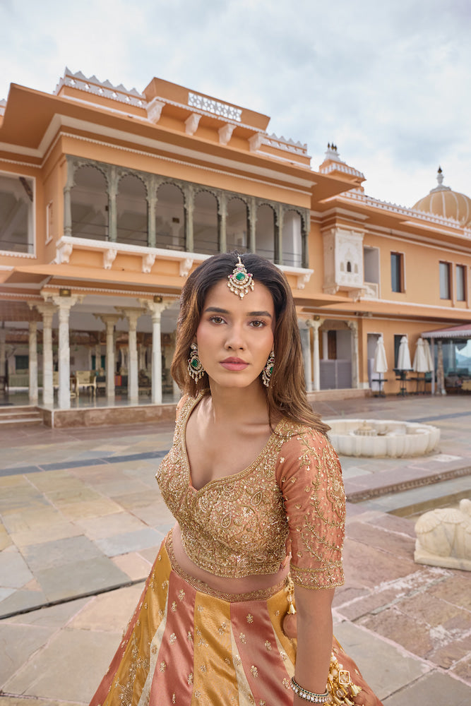 Peach Pink and Golden Beige Designer Lehenga Choli with Intricate Embroidery
