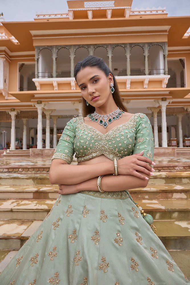 Pastel Mint Green Lehenga Choli with Golden Floral Embroidery and Flared Skirt