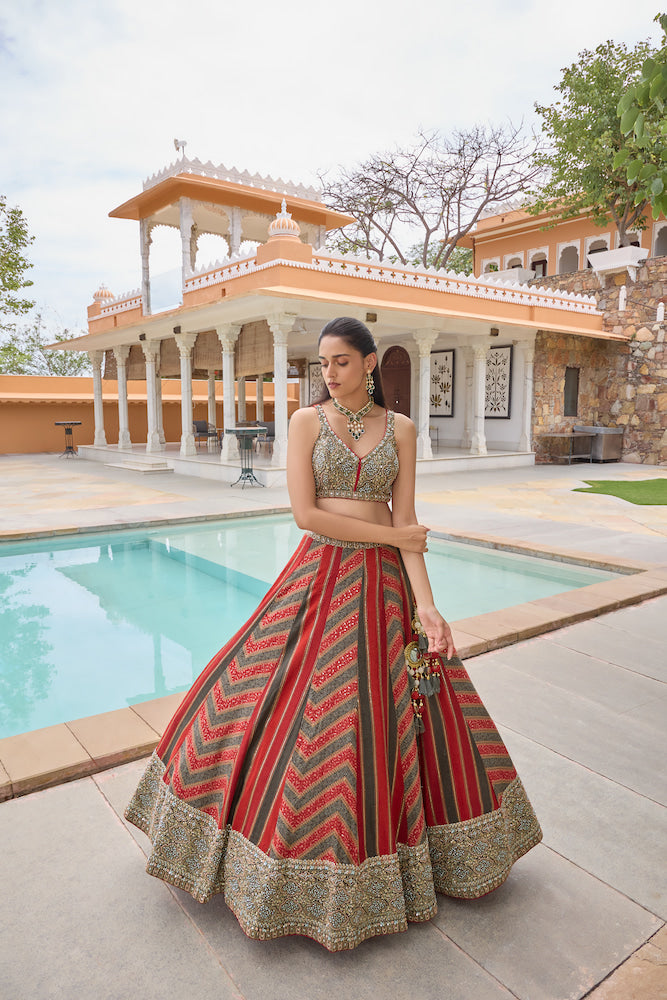 Dark Green and Red Lehenga Choli with Chevron Patterns and Golden Embroidery