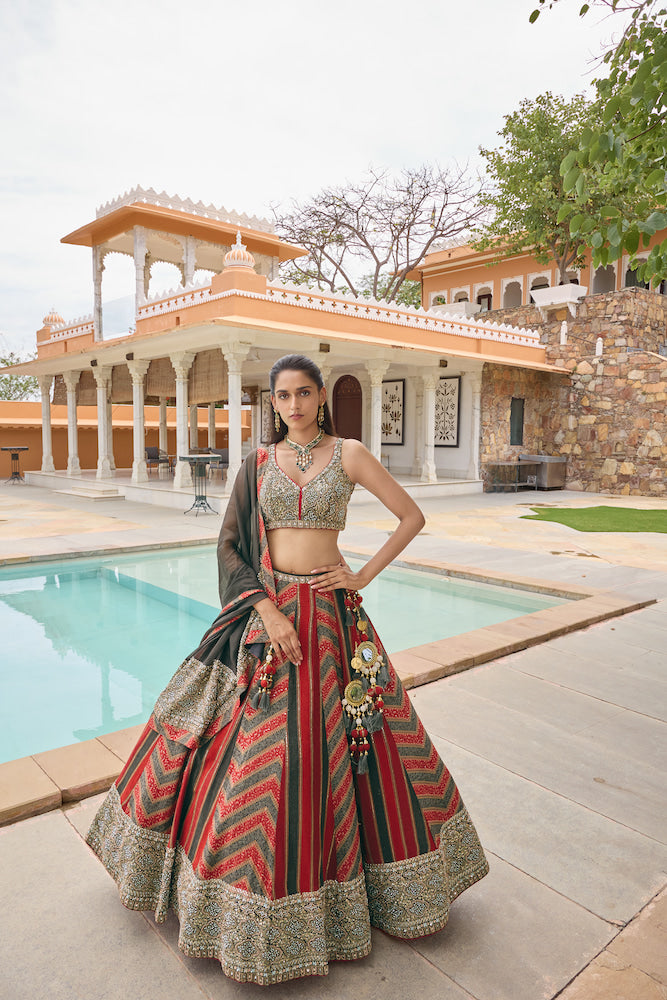 Dark Green and Red Lehenga Choli with Chevron Patterns and Golden Embroidery