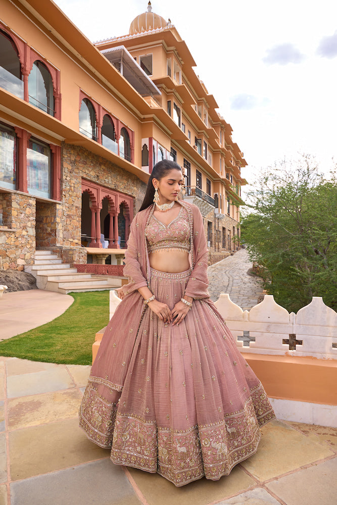 Dusty Pink Lehenga Choli with Intricate Golden Embroidery and Embellished Border