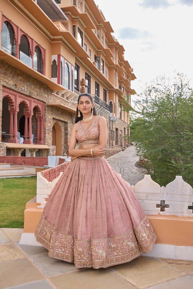 Dusty Pink Lehenga Choli with Intricate Golden Embroidery and Embellished Border
