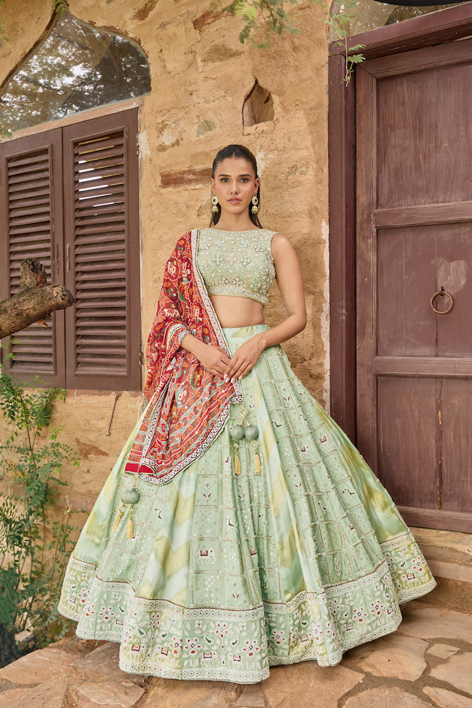 Mint Green Lehenga Choli with Red Printed Dupatta and Intricate Embroidered Border