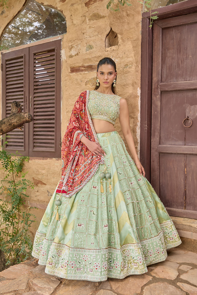 Mint Green Lehenga Choli with Red Printed Dupatta and Intricate Embroidered Border