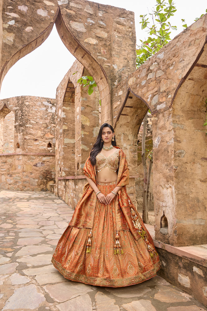 Rust Orange Lehenga Choli with Golden Embroidery and Matching Dupatta