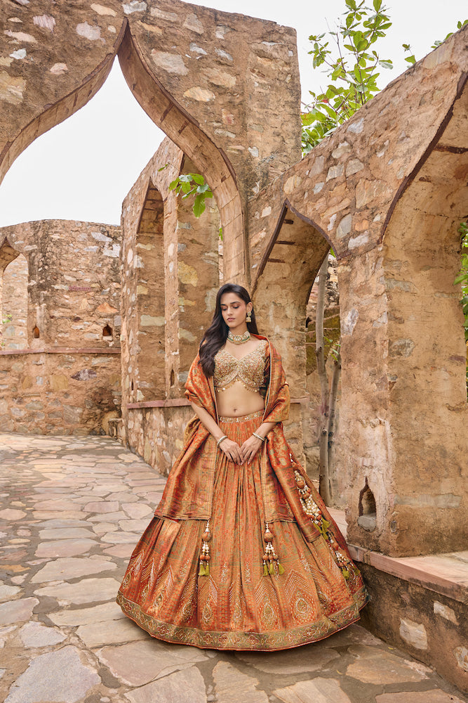 Rust Orange Lehenga Choli with Golden Embroidery and Matching Dupatta
