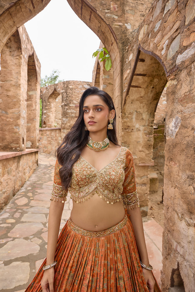 Rust Orange Lehenga Choli with Golden Embroidery and Matching Dupatta