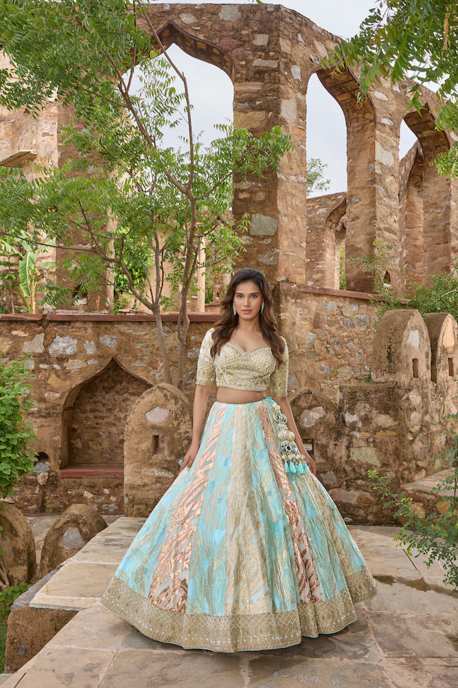Sky Blue and Ivory Lehenga Choli with Multicolour Panels and Golden Embroidered Border