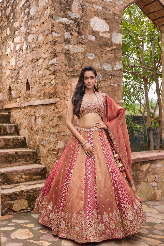 Peach and Rani Pink Lehenga Choli with Intricate Golden Embroidery