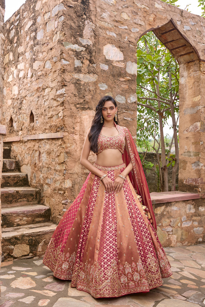 Peach and Rani Pink Lehenga Choli with Intricate Golden Embroidery