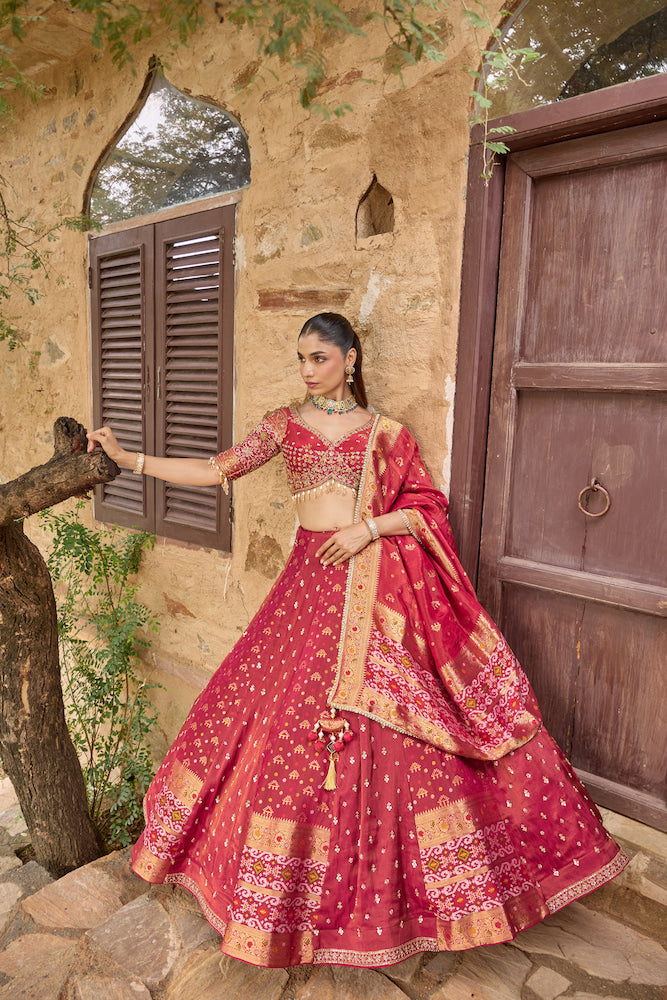 Deep Magenta Lehenga Choli with Golden Embroidery and Matching Dupatta