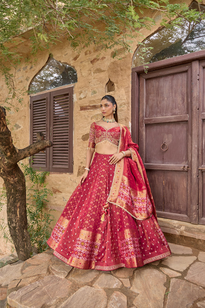 Deep Magenta Lehenga Choli with Golden Embroidery and Matching Dupatta