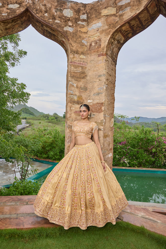 Peach Beige Lehenga Choli with Multicolour Floral Embroidery and Embellished Border
