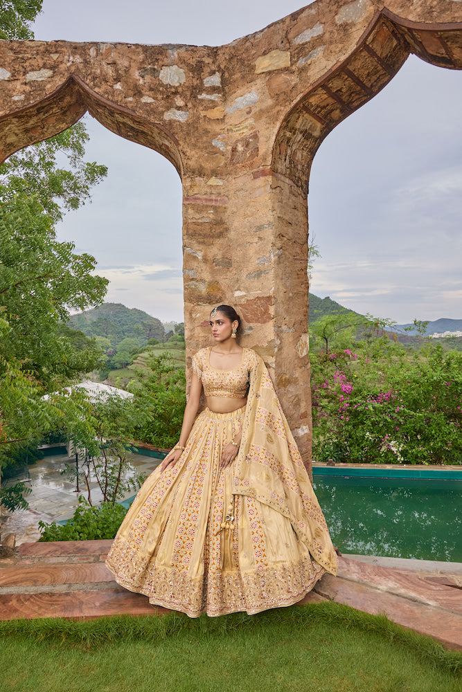 Peach Beige Lehenga Choli with Multicolour Floral Embroidery and Embellished Border